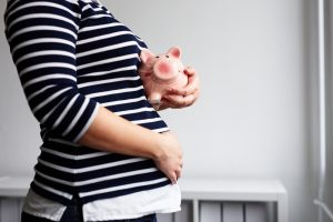 Pregnant,Woman,With,Piggy,Bank